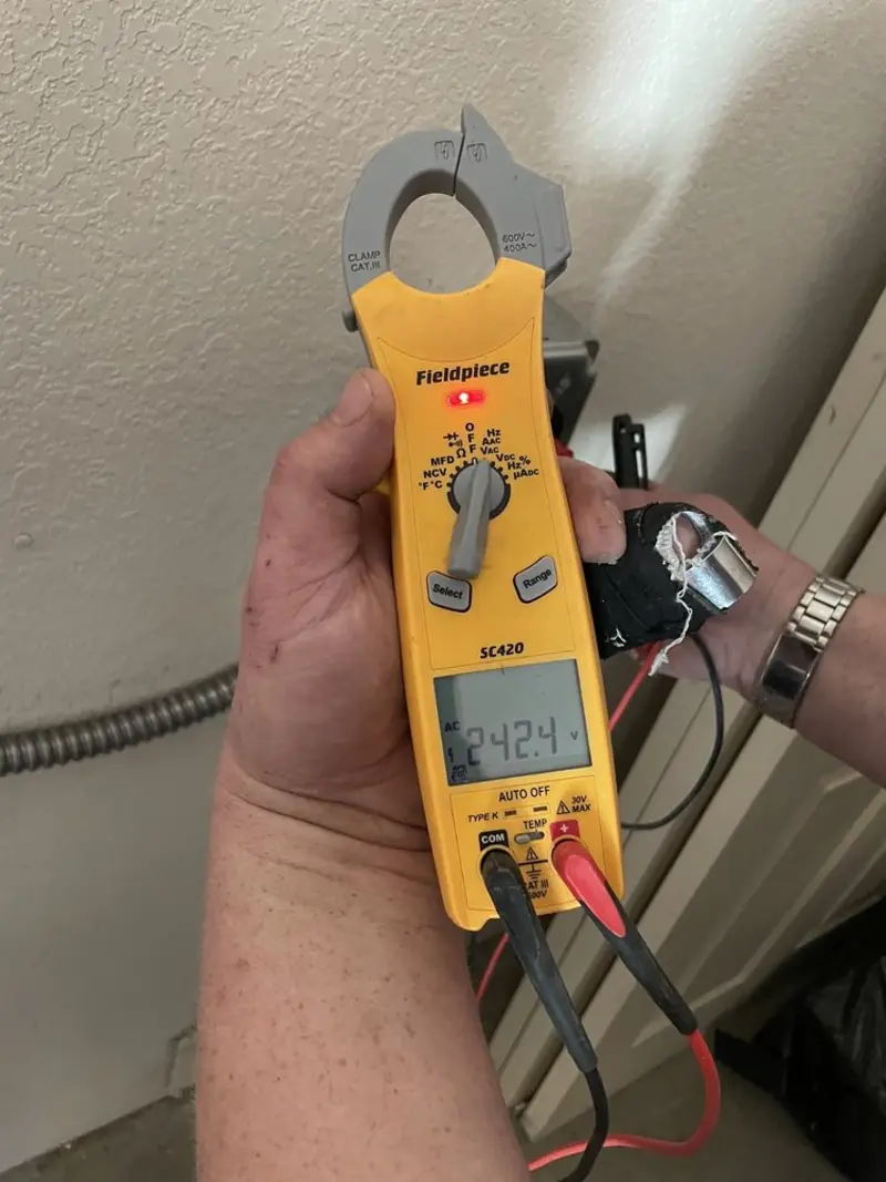 Voltage testing with clamp meter during Electrical Installation Services in Allendale